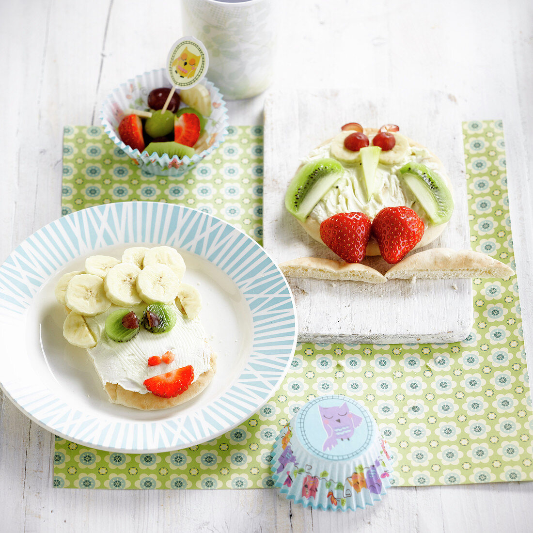 Funny face and owl's face fromage frais and fruit on pita bread