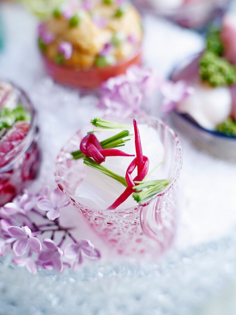 Squid sashimi in a hand-cut glass