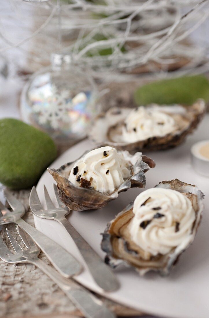 Oysters with whipped cream,foie gras and truffles