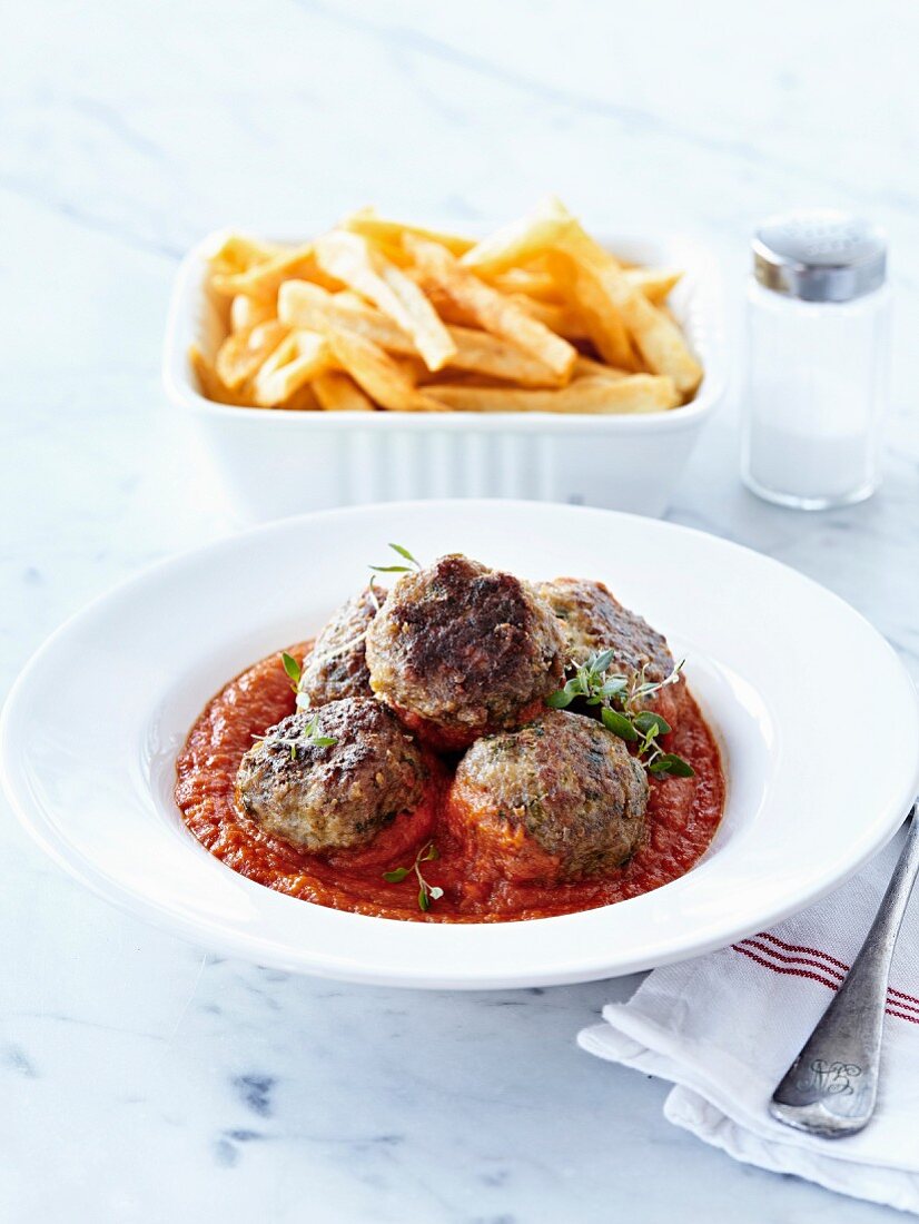 Beef meatballs in tomato sauce,French fries