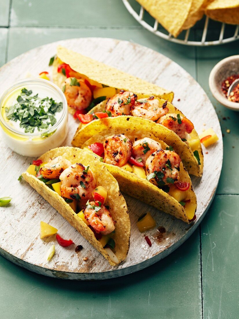 Shrimp,red and yellow pepper tacos,yoghurt and herb sauce
