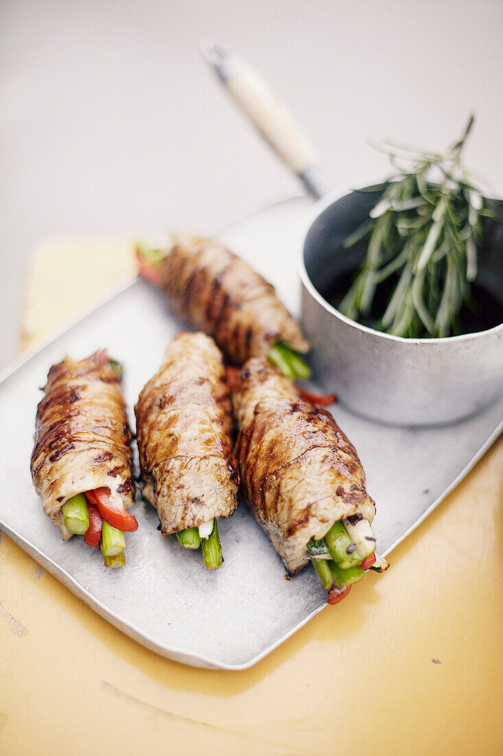 Veal rolls stuffed with summer vegetables with rosemary sauce
