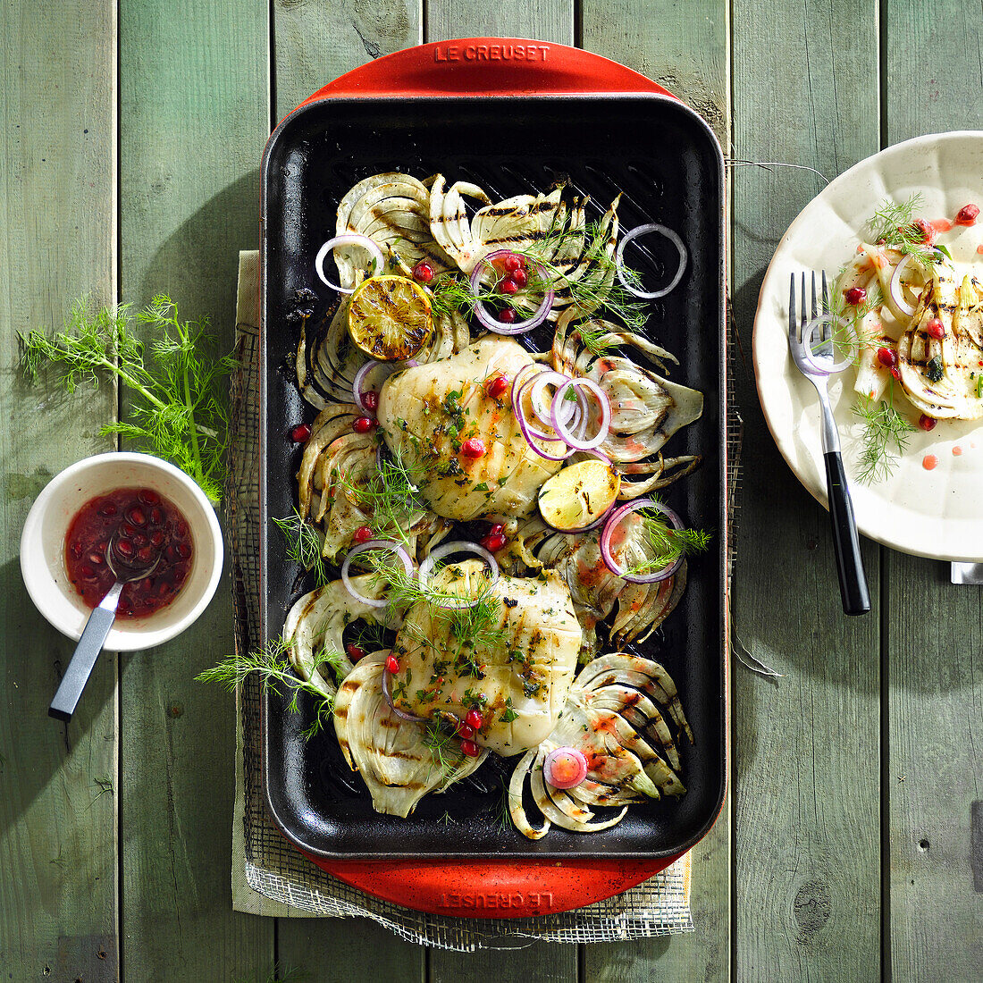 Grilled squid with fennel and pomegranate seeds