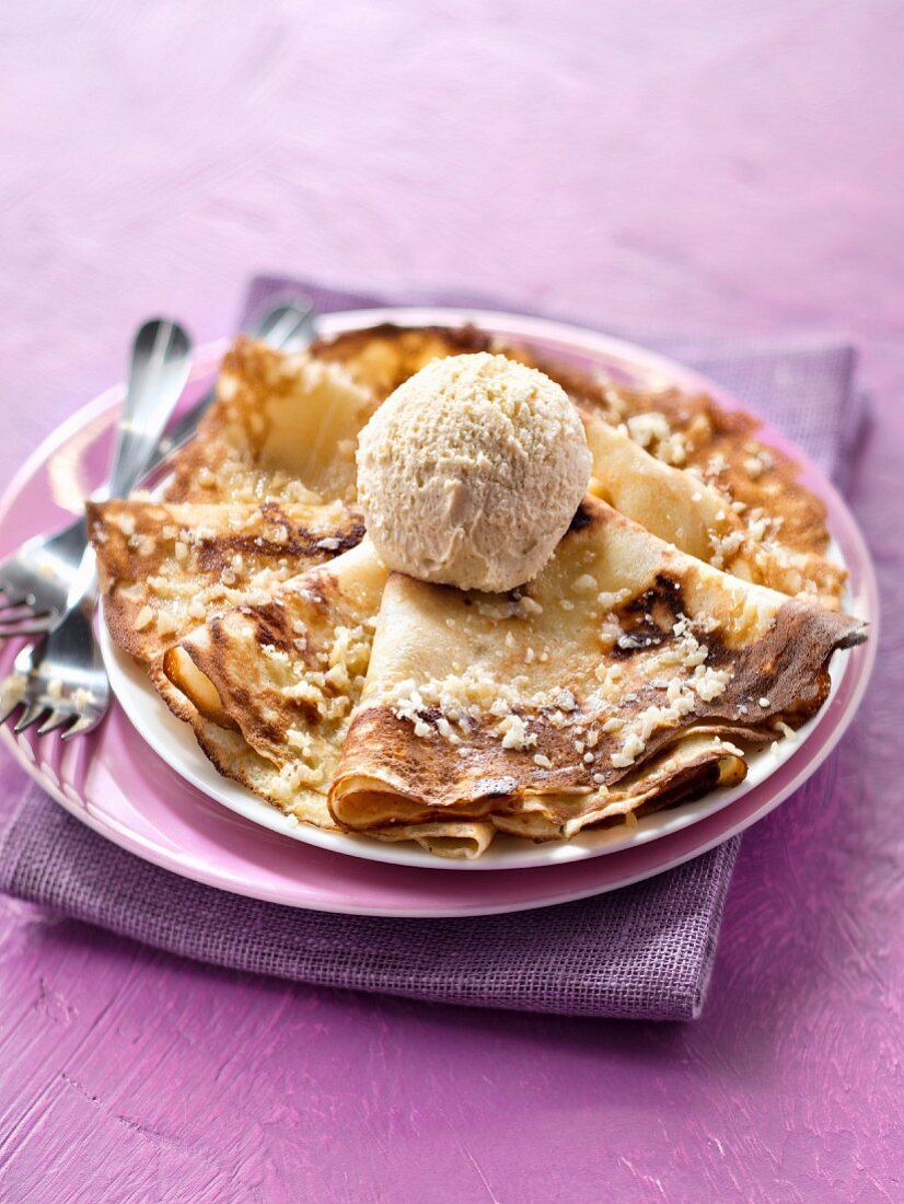 Pancake with vanilla ice cream and almonds