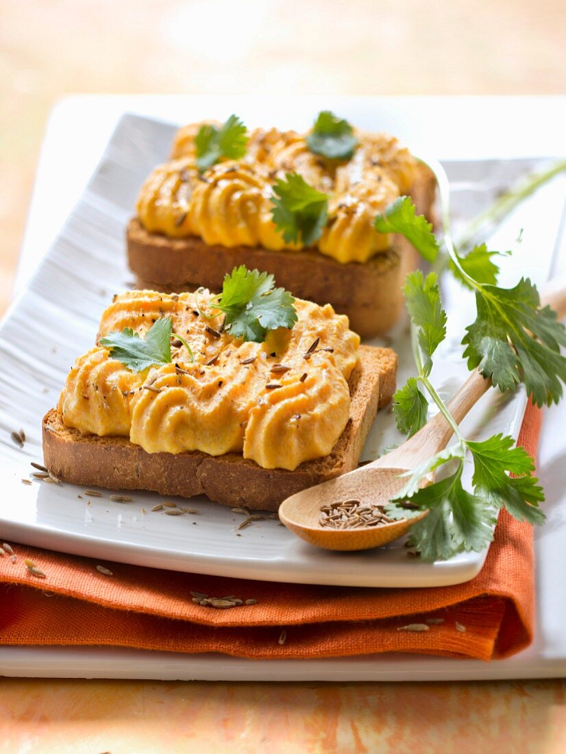 Crunchy carrot mousse with cumin on toast