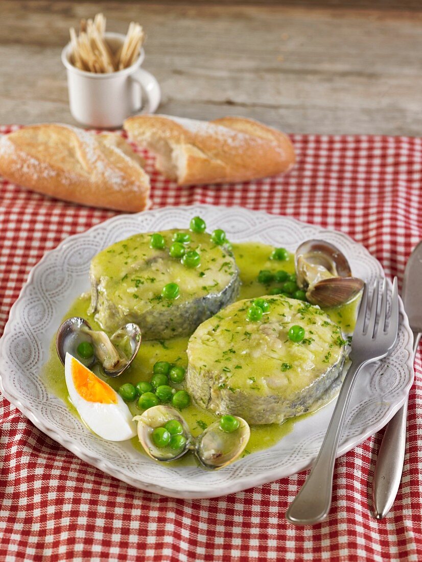 Hake in pea and cockle sauce