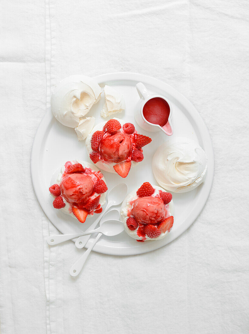 Mini pavlovas with strawberry ice cream