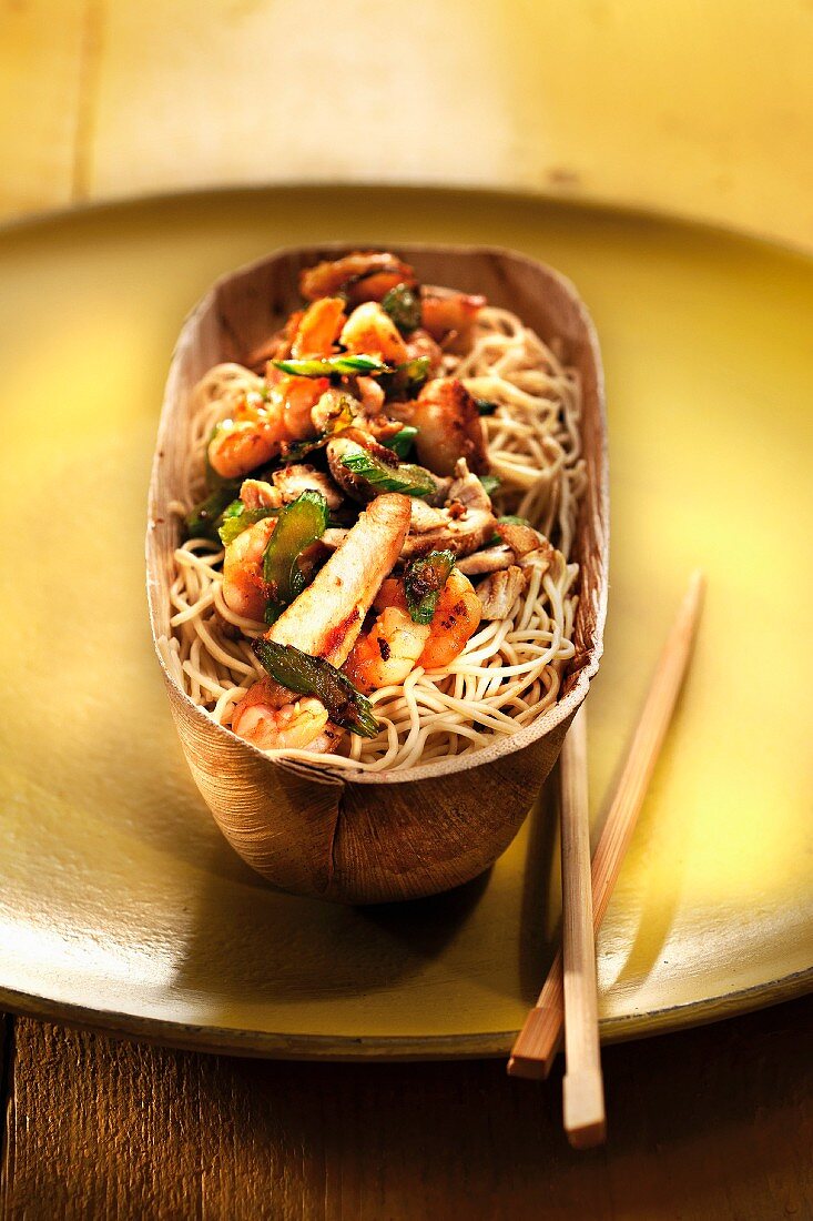 Chinese noodles with chicken,herbs and vegetables