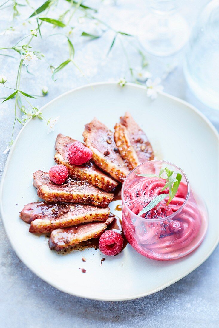 Duck magret with balsamic vinegar and raspberry-poppyseed sorbet