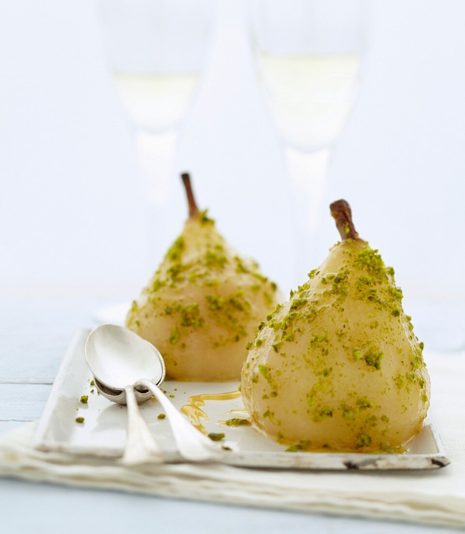 Poached pears with caramel and crushed pistachios