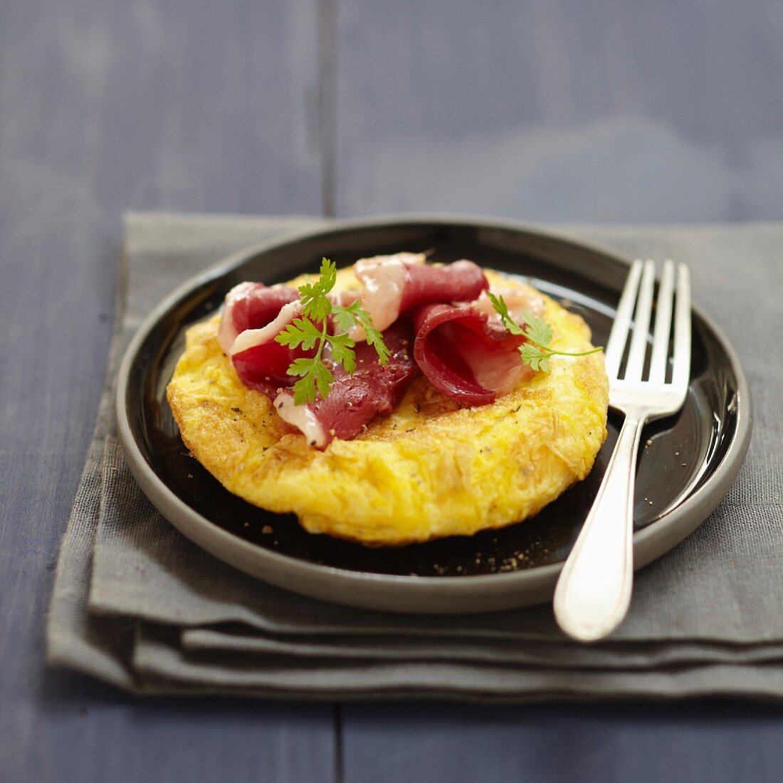 Cheese omelette with duck magret