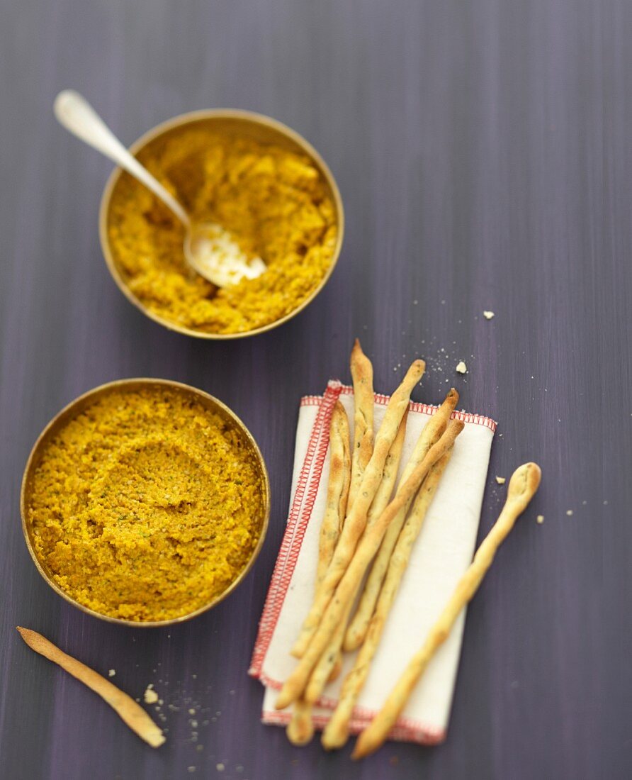 Carrot and sesame caviar with homemade breadsticks