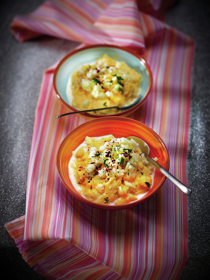 Scrambled eggs with apple brunoise, herbs and spices and cream