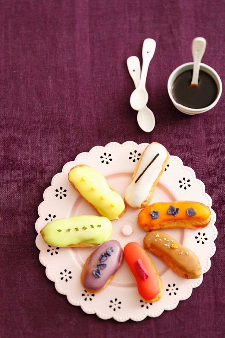 Various eclairs on a plate