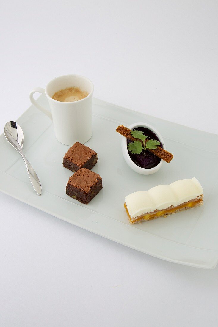 Gourmand coffee with brownie, chocolate cream and apricot Mille-feuille