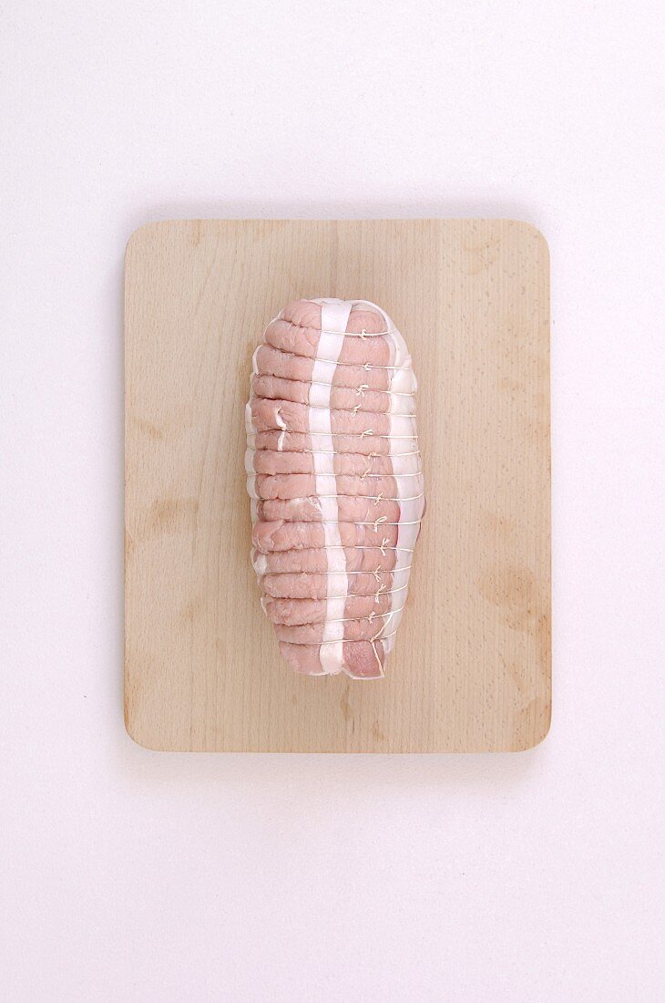 Raw pork roast on a chopping board