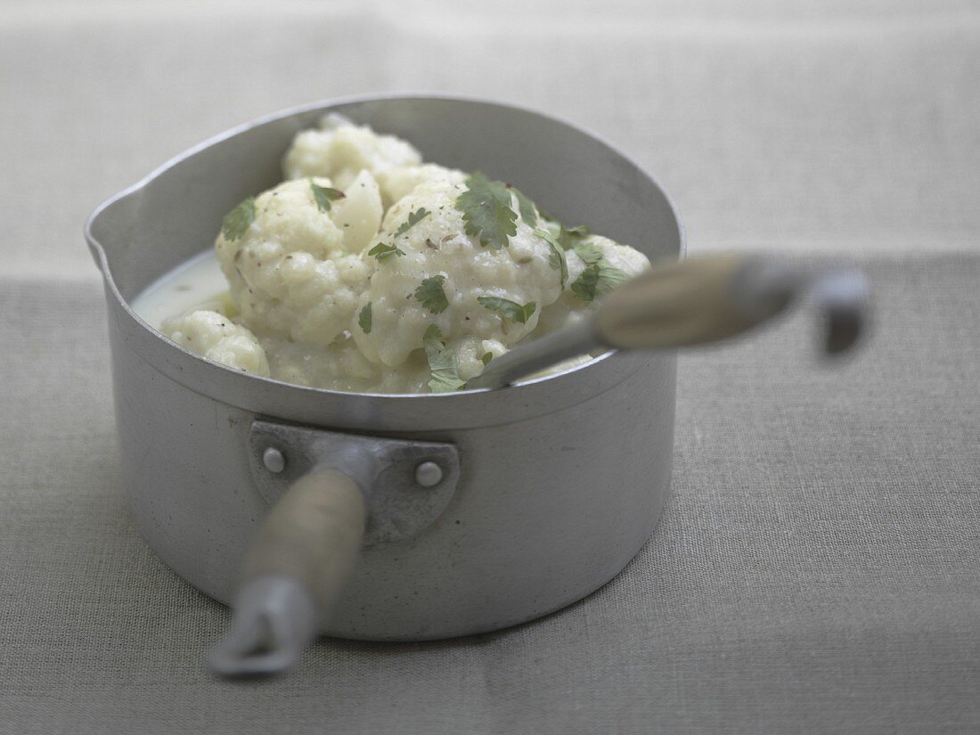 Cooking the cauliflower in milk for the soup