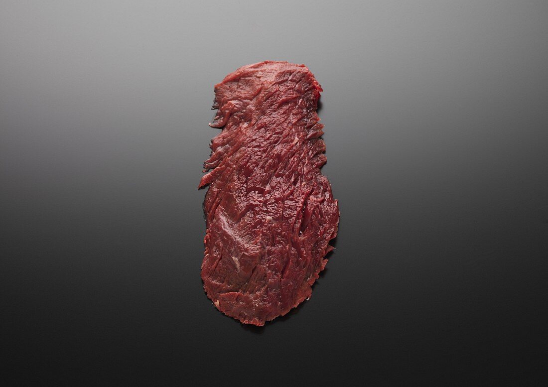 Raw beef flank steak
