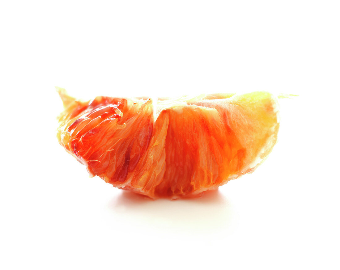 Blood orange segment on a white background
