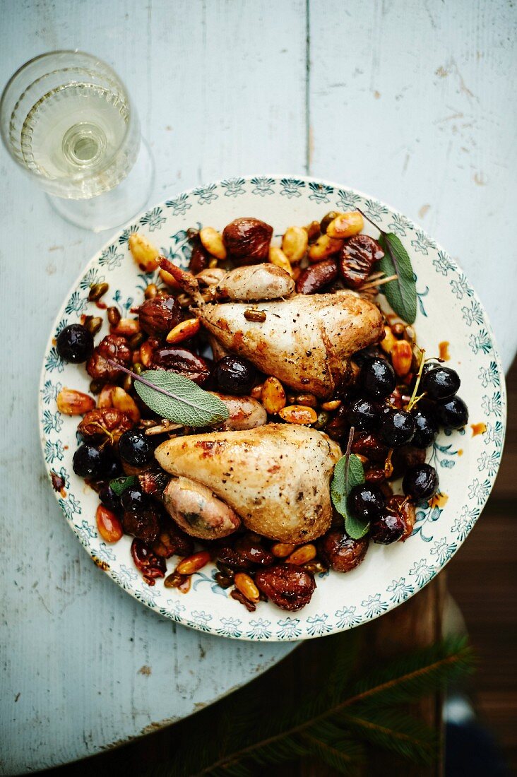 Quail with purple grapes, almonds, chestnuts and sage