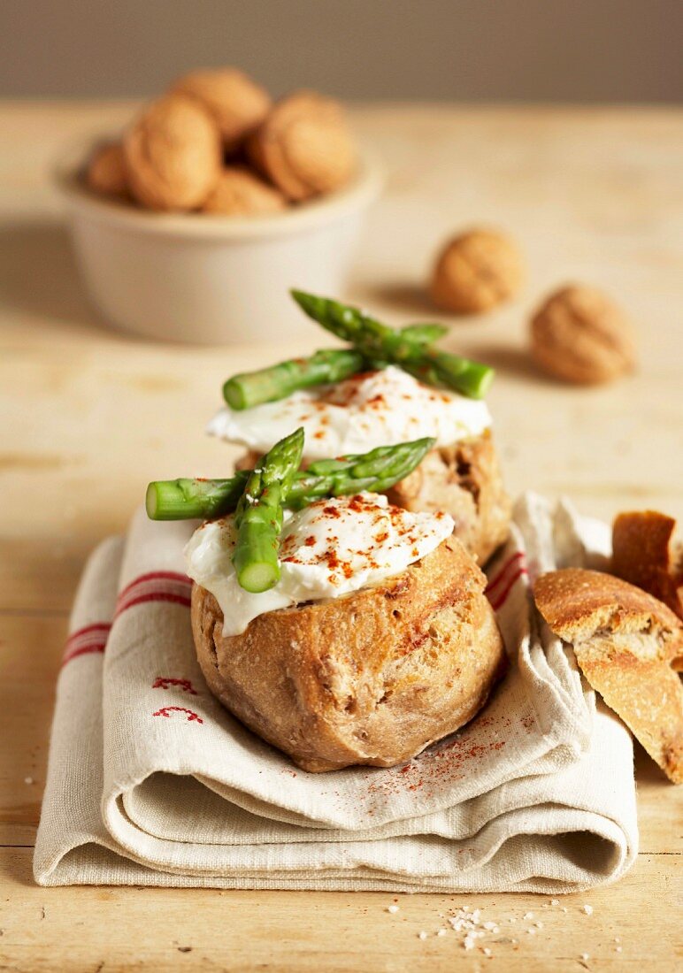 Poached egg and asparagus walnut bread nests