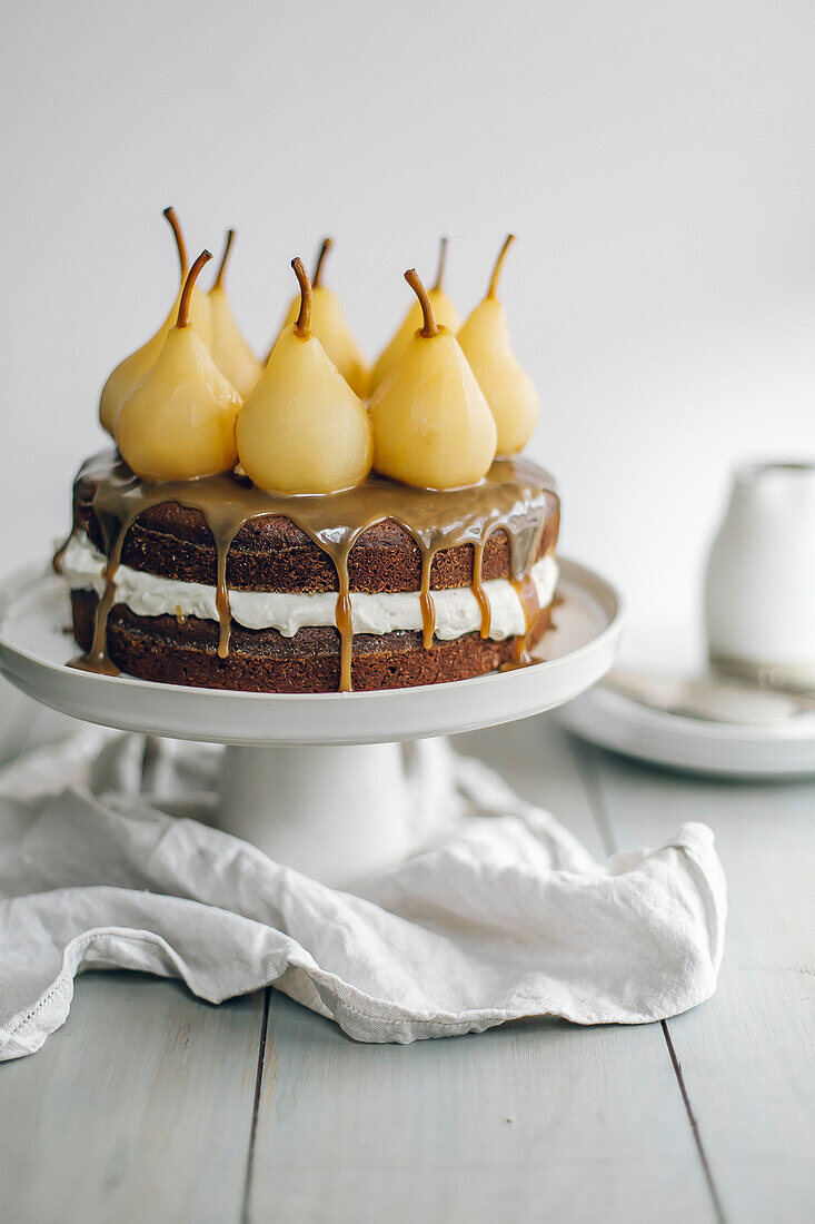 Chocolate cake with toffee sauce and poached pears