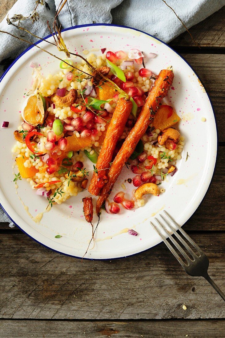 Pearl pasta with caramelized carrots, pomegranate, orange and cashews