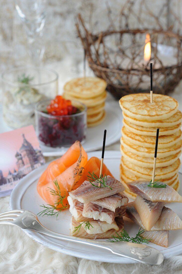 Marinated smoked salmon, smoked herrings and blinis, beetroot salad, eel and vodka for a Russian New Year