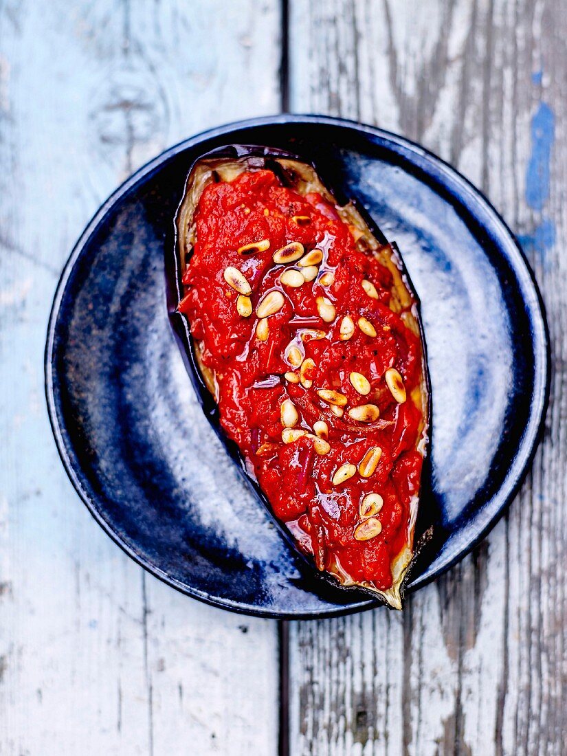 Roasted aubergine with tomatoes and pine nuts