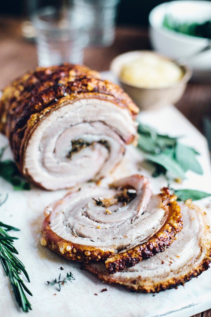 Rolled pork breast with herbs