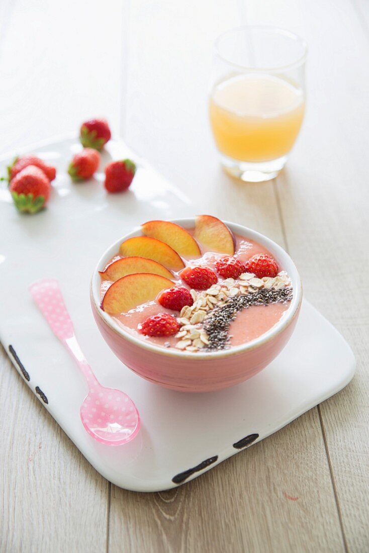 Peach-strawberry, porridge and chia bean smoothie bowl
