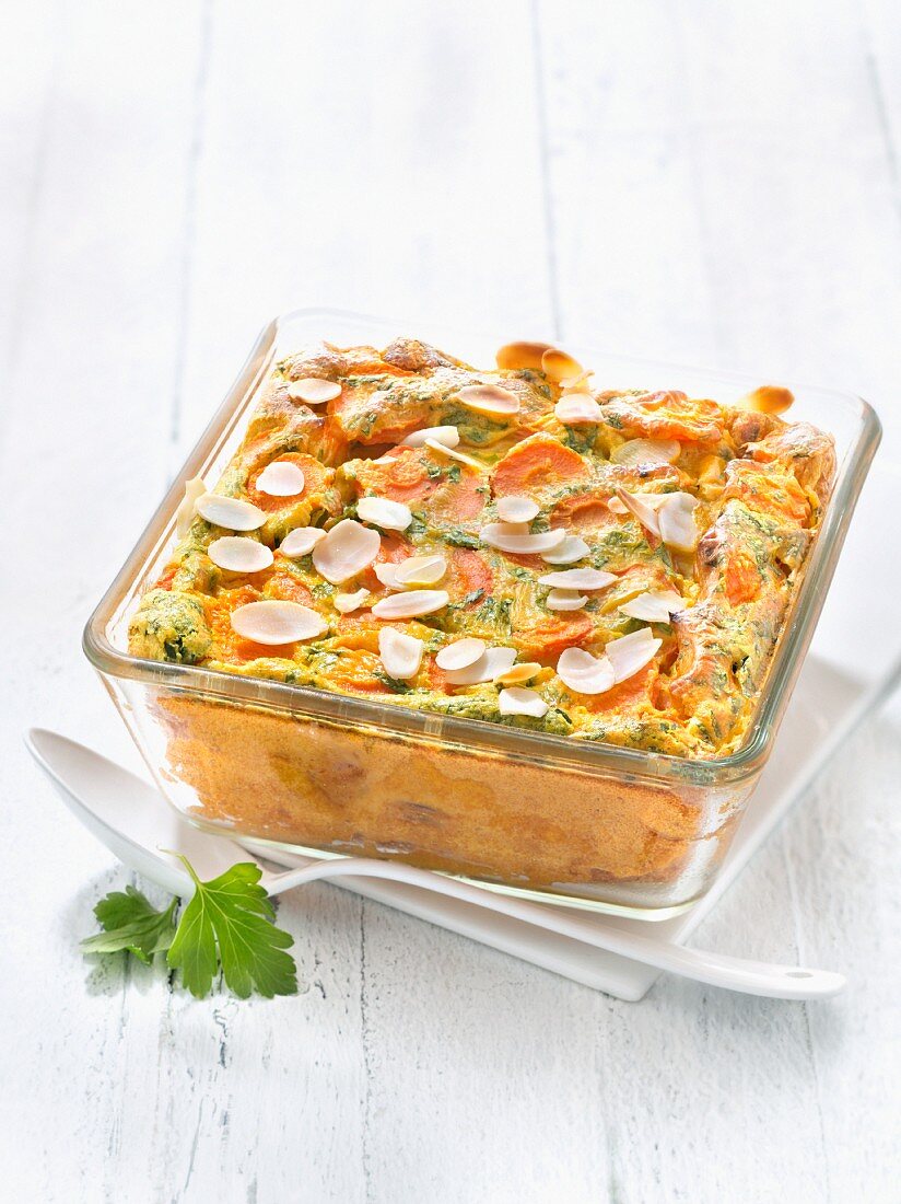 Carrot And Parsley Clafoutis Sprinkled With Thinly Sliced Almonds