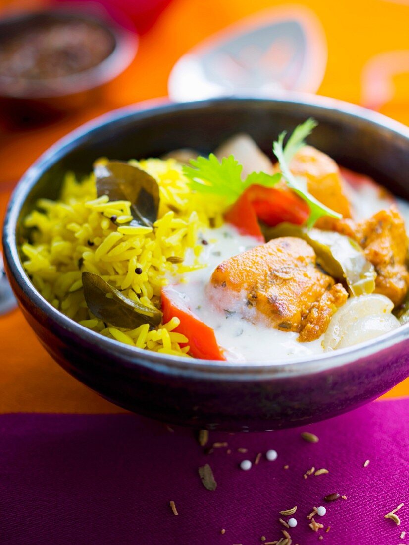 Basmati rice, chicken marinated with herbs and peppers, spicy yoghurt sauce