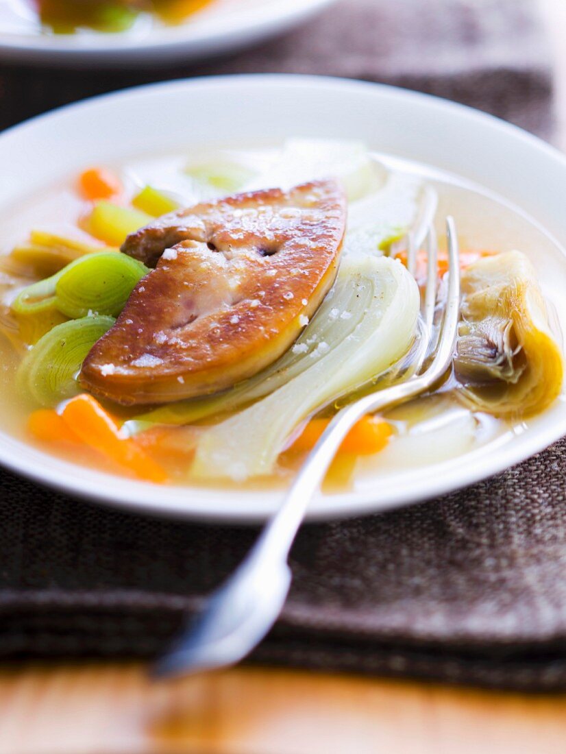 Vegetable broth with pan-fried foie gras