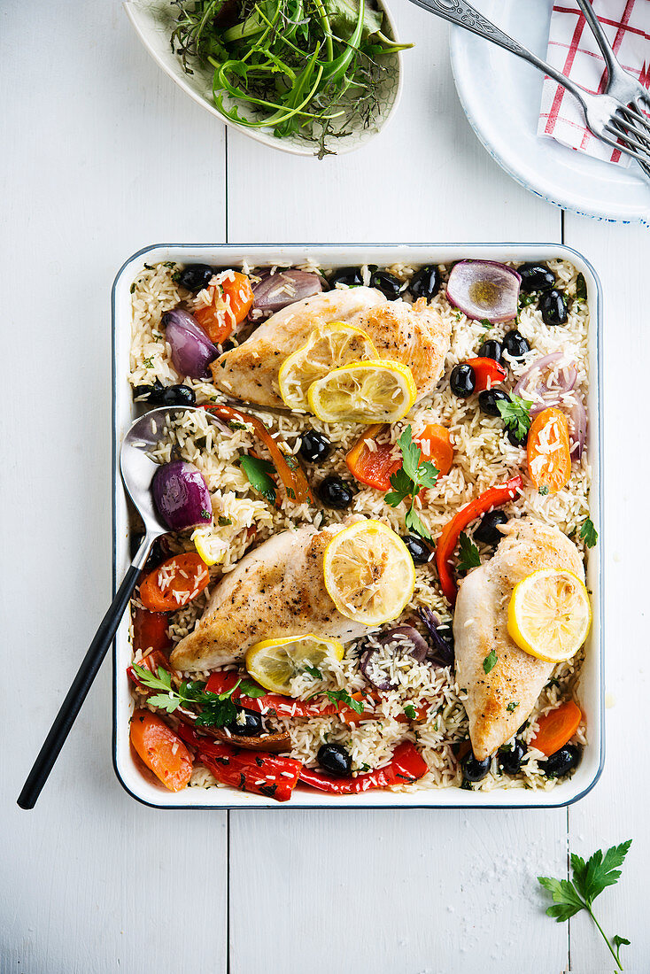 Spanish rice with olives, carrots, peppers, red onions and lemon chicken breast