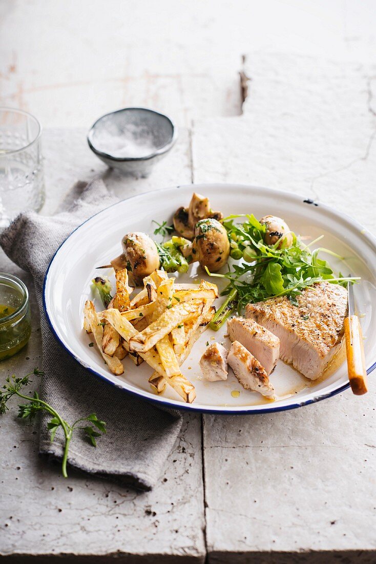 Grilled turkey fillet, celeriac chips and mushrooms with herbs