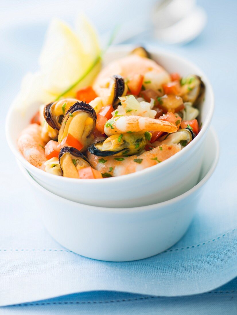 Mixed shrimps, mussels and diced tomatoes with chopped parsley