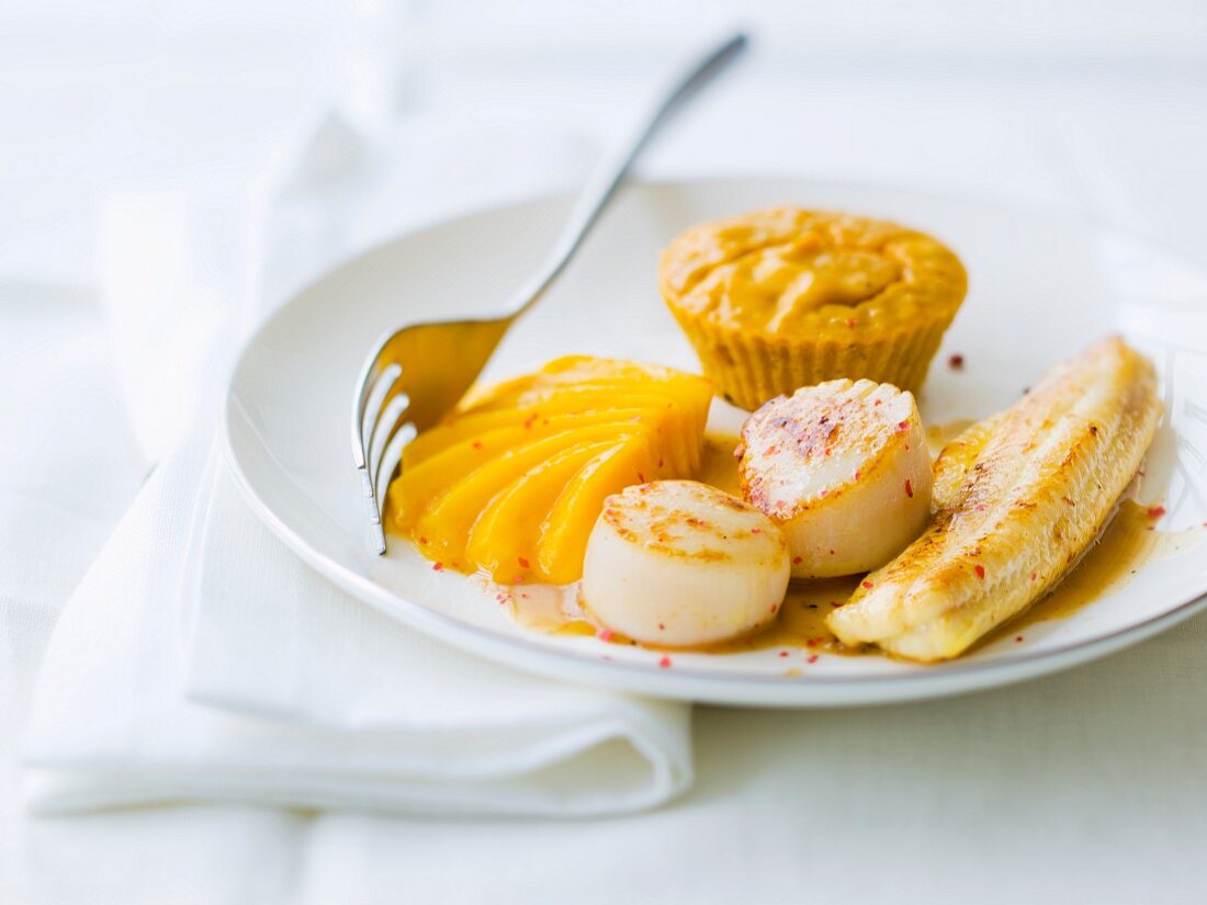 Haddock and scallops, stewed mango and two pepper flans