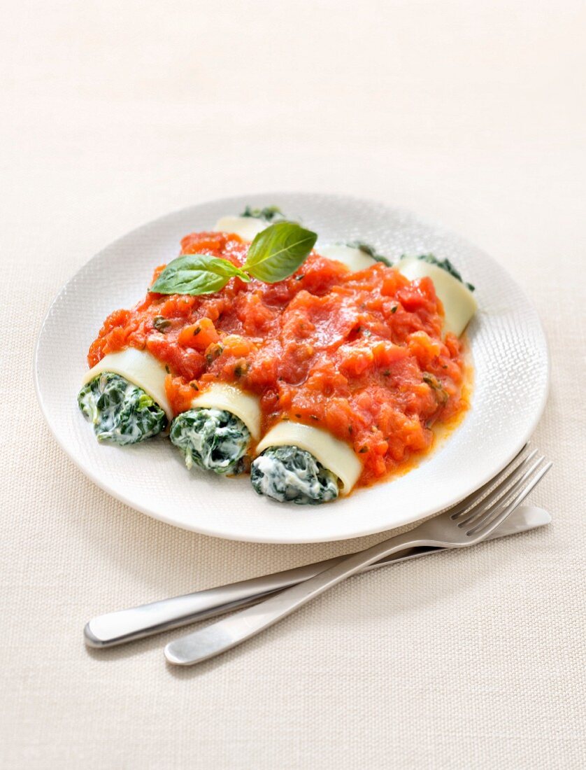 Spinach and ricotta cannellonis with stewed tomato sauce