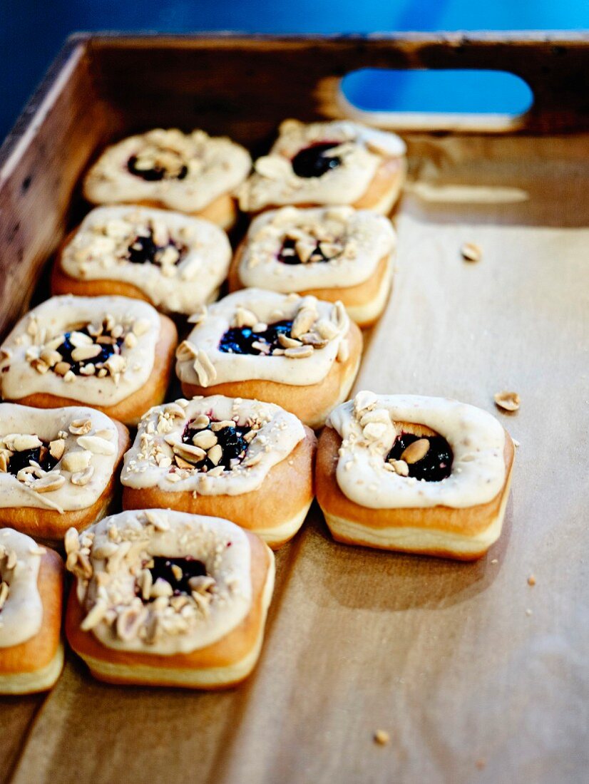 Leavened donuts with blackcurrant jam center and Crosstown peanut butter frosting