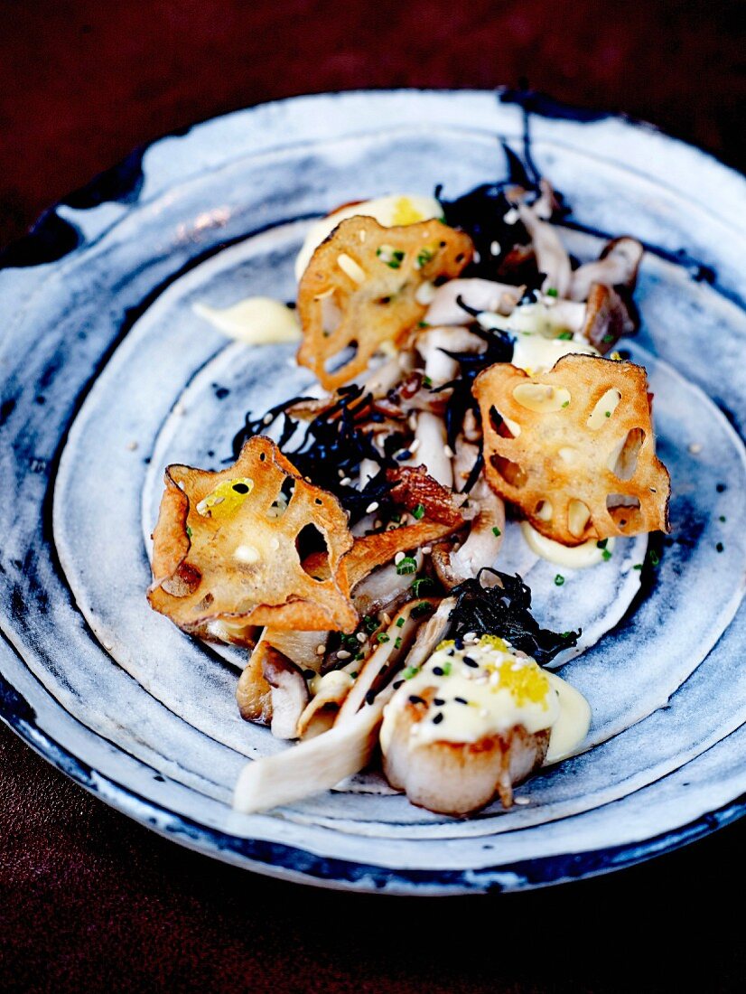 Lotus crisps with roasted scallops, pan-fried shimeji mushrooms and truffle Béarnaise