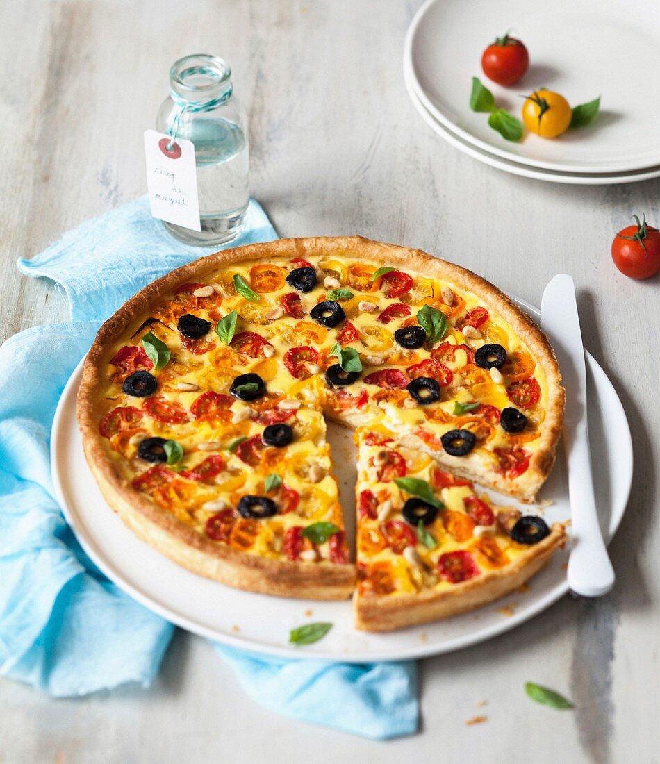 Red and yellow cherry tomato pizza