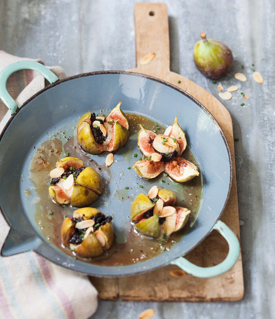 Roasted figs with scallops, tapenade and thinly sliced almonds
