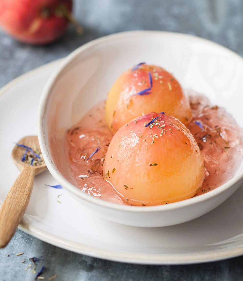 Poached pears in rose jelly, Herbes de Provence and borage flowers