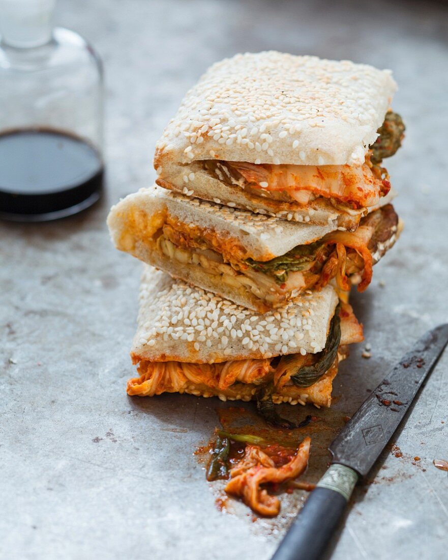 Tempeh, kimchi and mayonnaise sesame bread sandwich