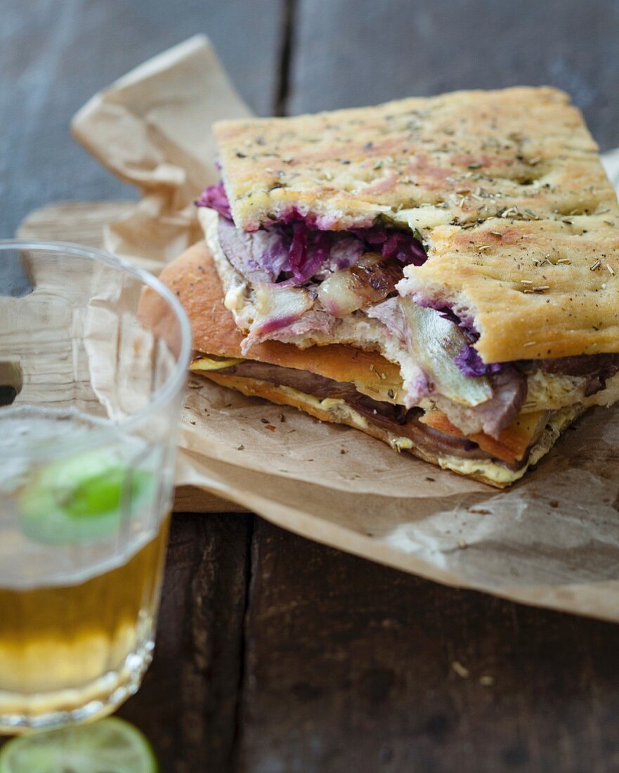 Leg of lamb, pickled red cabbage, onion petals and oyster mayonnaise focaccia sandwich