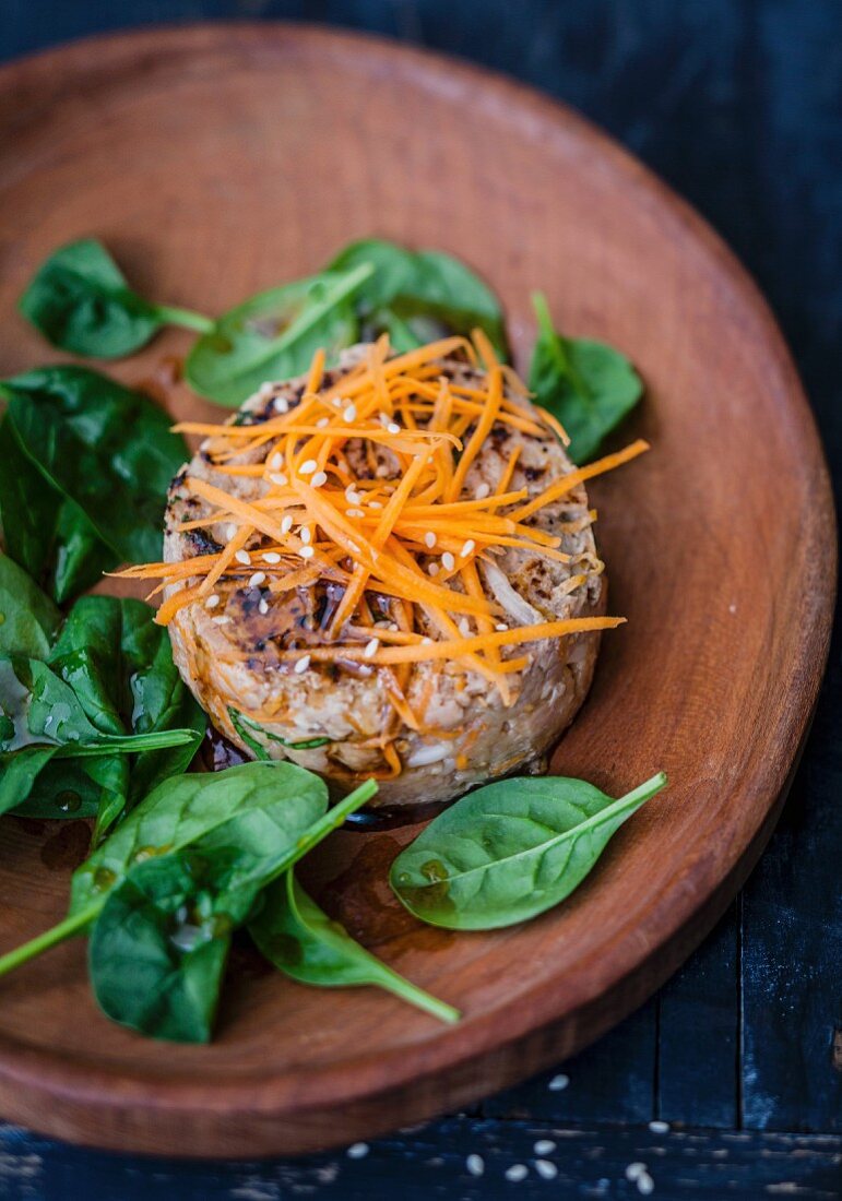 Veal tartare with bean sprouts, sesame, grated carrots and Thai basil, soya-sesame sauce with fresh spinach