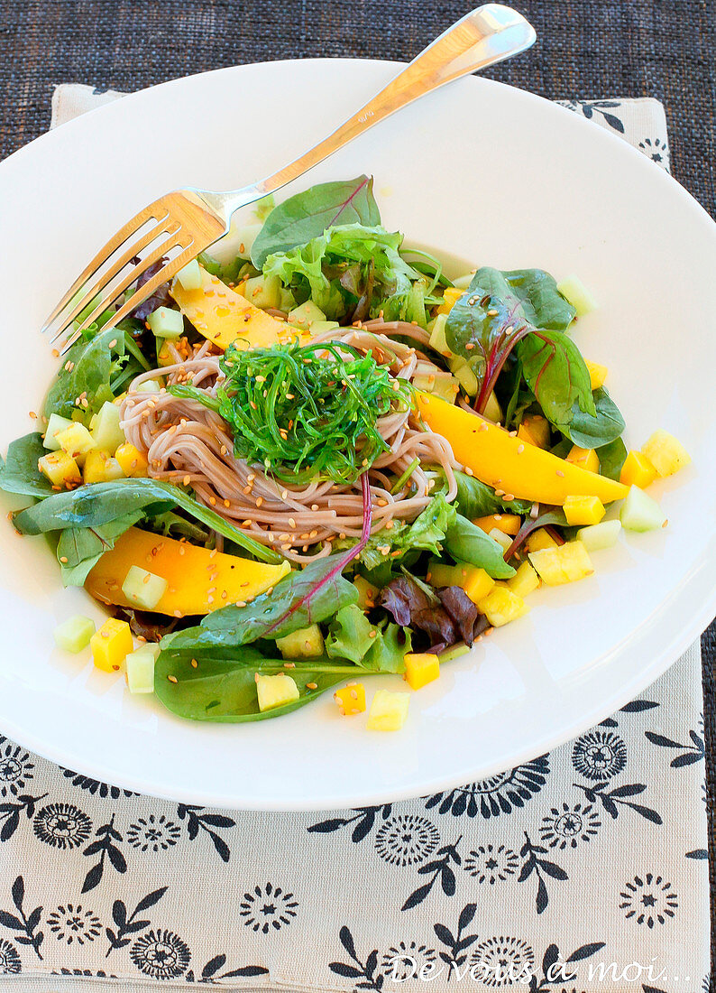 Asian-style noodle, mango and green seaweed salad