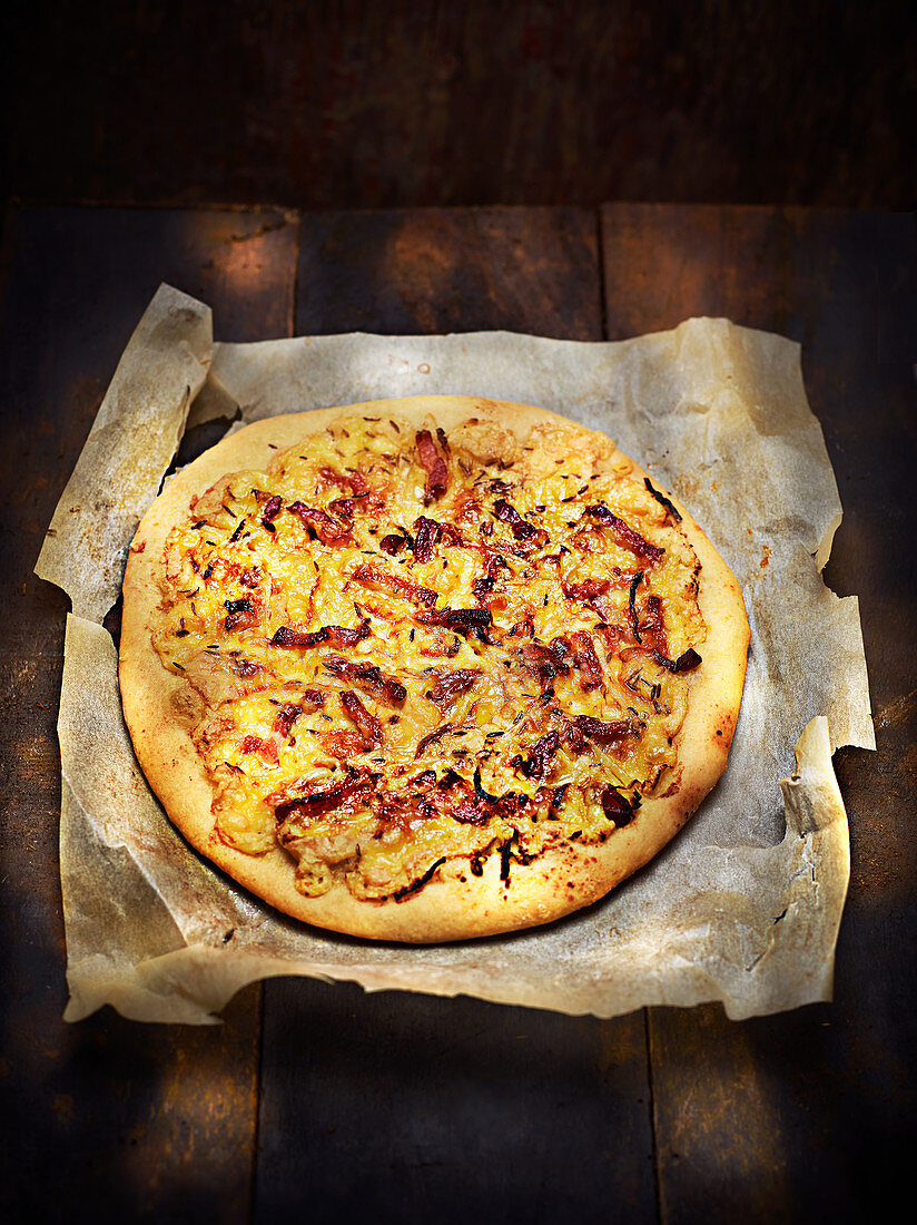 Munster cheese, onion, bacon and cumin pizza