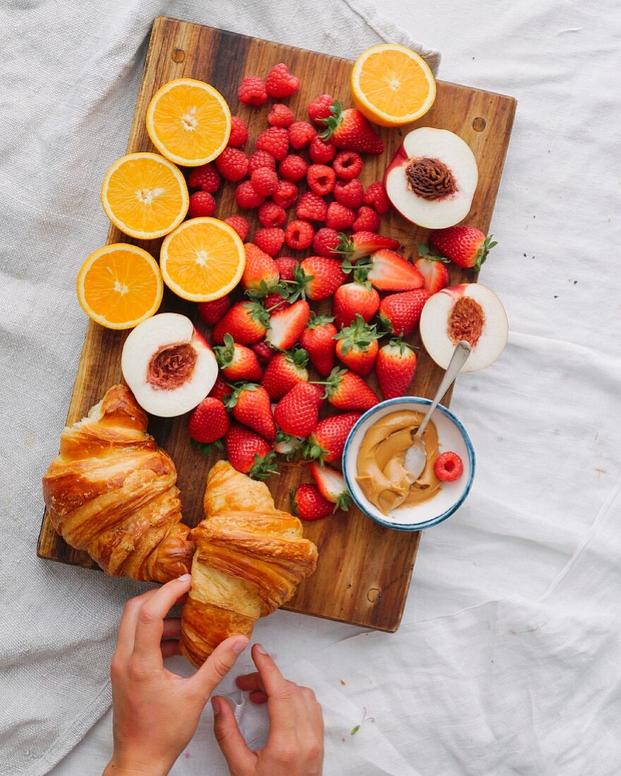 Breakfast with croissants and fresh fruit